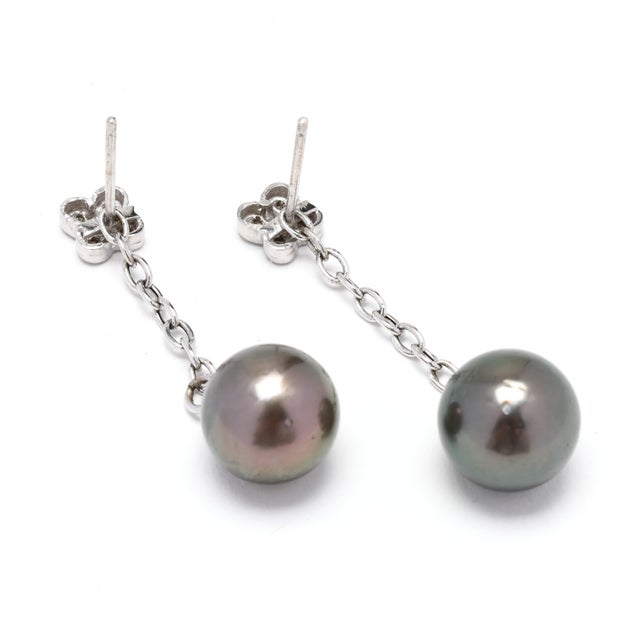 Stones: diamond round brilliant cut 1.4 mm approximately .10 total carats IJ color/ I1-2 clarity tahitian pearl, 2 round...