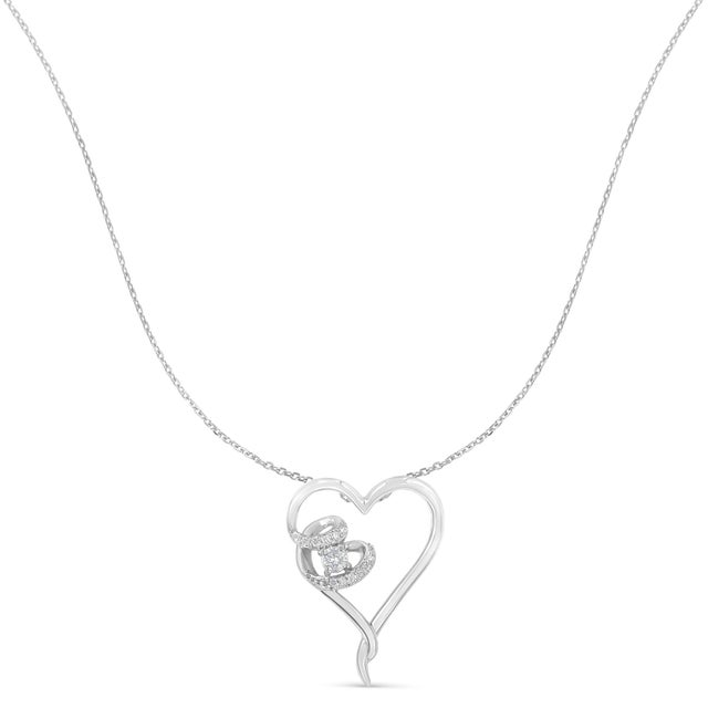Twelve delicate, sparkling diamonds adds extra twinkle to this beautiful heart pendant necklace. The diamonds are set in...