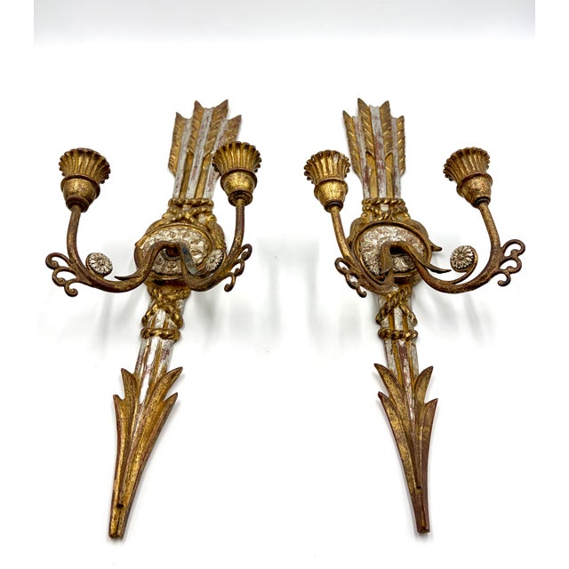 A beautiful pair of antique Italian silver and gold gilded wood and tole two arm candle wall sconces. Signed by artist and...