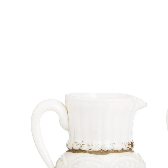Glass and Crystal - Pair of opaline glass mugs. Made of opaline glass; with embossed and gold decoration. Height: 16 cm.