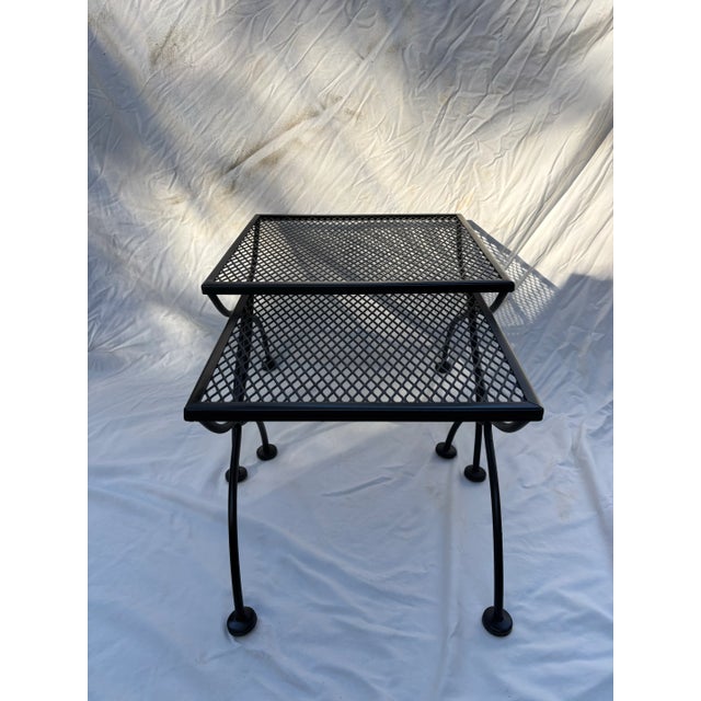 set of two woodard nesting table. freshly sanded and painted larger table is 19.5 by 19.5 by 16 tall smaller table is 16...