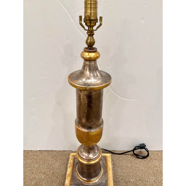 Stylish Wilwood Co Carved Italian Lamp. Antique distressed finish, square base. Gold accents. Showroom floor sample.