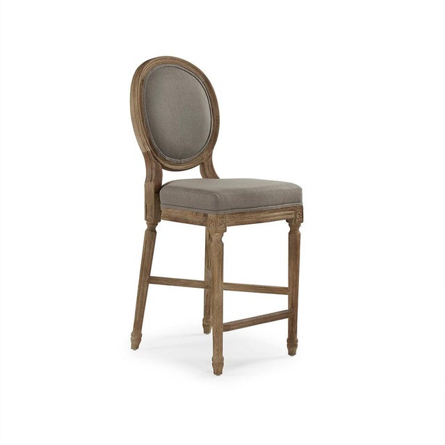 The Medallion Counter Stool from Zentique brings the iconic Louis XVI oval-back (medallion) silhouette to counter height...