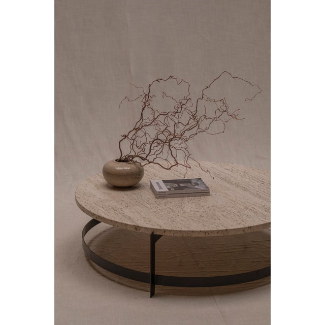 A refined and minimalist round coffee table from the 1970s, crafted in solid travertine and defined by its generous scale...