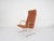 Very rare lounge chair designed by Dieter Rams for Vitsoe. The chair has been reupholstered in cognac faux-leather. The...