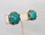 1970s goldtone single round cabochon faux-jade with what looks like "petals" around the edges clip earrings. Marked...