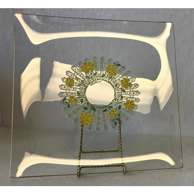 Very rare 1960's vintage square glass serving dish. The multi-color daisy and picket fence pattern has varying shades of...
