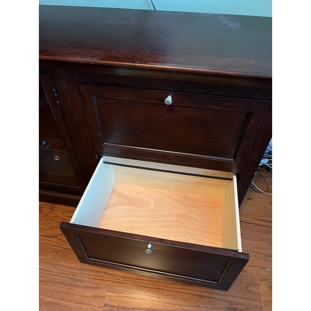 Java finish. Customer-configured piece with glass door hutch on the left side and two large file drawers on the right....