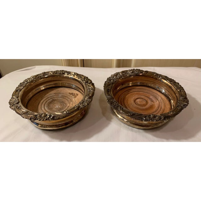 These Victorian style antique bottle coasters are unsigned, but presumed to have originated from England and date to...