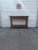 We have an absolutely gorgeous vintage boho rattan console table for sale. It features woven wicker detailing, a center...