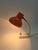 This desk lamp from the 1970s is built on a distinctive, compact design: an orange metal shade with a semi-matte finish...