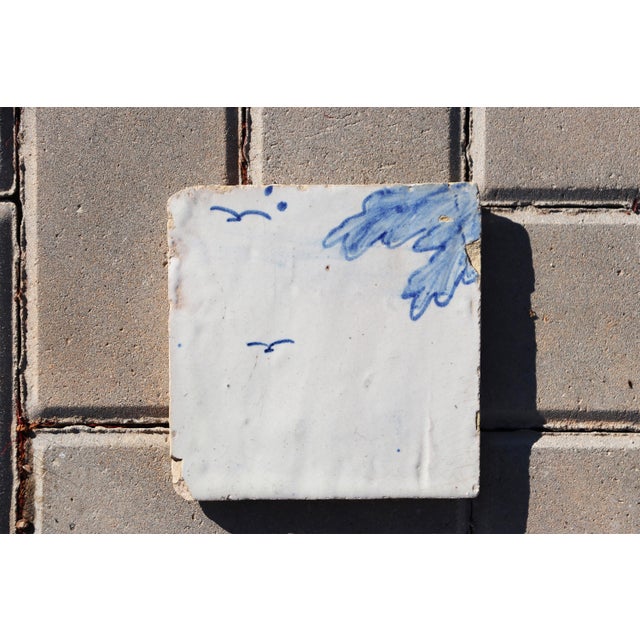 Circa: 18th Century. Country: Portugal. Material: Earthenware, Tin-glazed pottery. Note: This tile was once part of a...