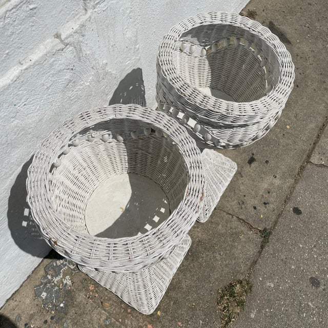 Interesting beaded floor planters in wicker, painted white circa 1970's. Each holds a 9" wide plant, great for monsteras...