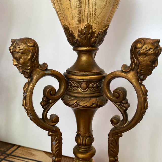 Gorgeous pair of Vintage neoclassical lamps with metal details. These lamps boast class and design. Lions feet lamps....