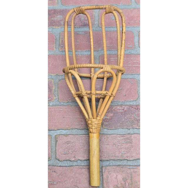 Set of 2 vintage rattan rug beaters in warm honey/natural tones. Handwoven rattan and bamboo construction with a beautiful...