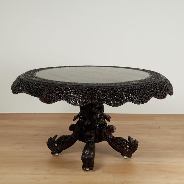 Impressive 19th century Anglo Indian center table handcrafted in rosewood featuring a round top with a scalloped skirt...