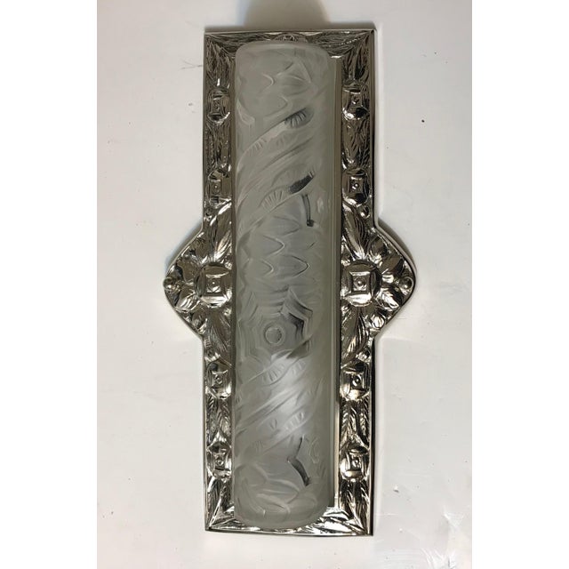 Stunning pair of French Art Deco sconces were created by the French artist Charles Schneider. Frames are in polished...