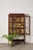 Edwardian mahogany glass-front display case featuring elegant spade legs, rich mahogany tones, and beautifully detailed...