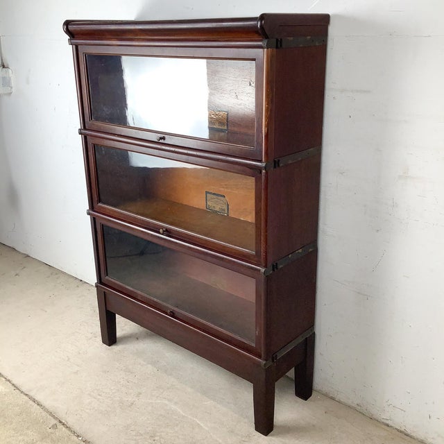The Globe-Wernicke barrister bookcase is one of the great American antiques — and this three-section Grade 598 mahogany...
