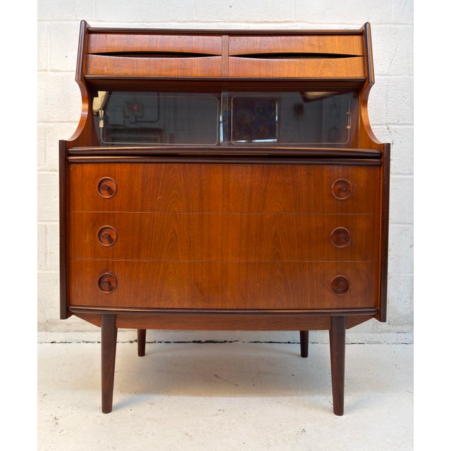 Elegant mid-century modern secretary desk designed by Gunnar Falsig for Falsig Møbler, featuring warm teak construction...