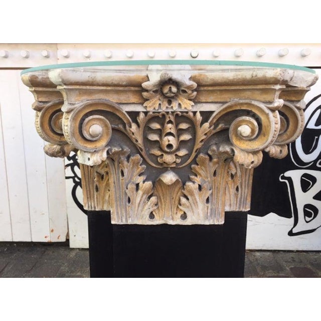 A pair of 18th century white marble and gold gilt columns tops from a Italy's church. Converted into side tables these...