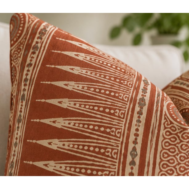 A beautiful pair of custom 22" x 22" pillows featuring Lee Jofa Indian Zag in Paprika, an iconic Suzanne Rheinstein...