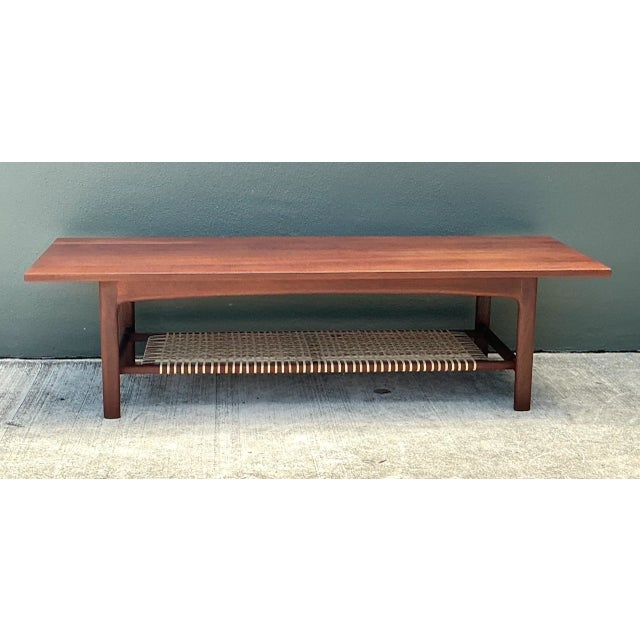 This vintage Swedish coffee table was crafted by Dux, a name synonymous with innovative mid-century Scandinavian design. A...