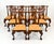 Stately Henredon Rittenhouse dining table with 10 carved chairs, 2 arms and 8 side chairs, crafted in richly finished wood...