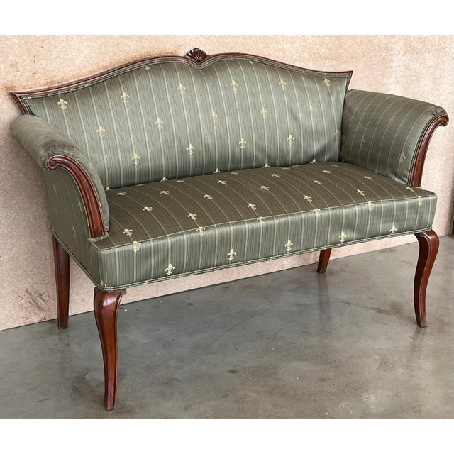 An unusual early 20th century Adam style carved mahogany window seat, having serpentine back and seat with scrolled out-...