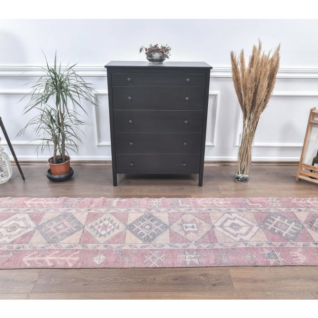 Vintage Turkish Shabby Hand-Knotted Runner Rug is a semi-Vintage rug. '80s Oushak region of Turkey's unique rug is...