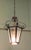 This impressive piece is made in Glass and decorative Wrought Iron, the shade has both diffused and plain glass panels. A...