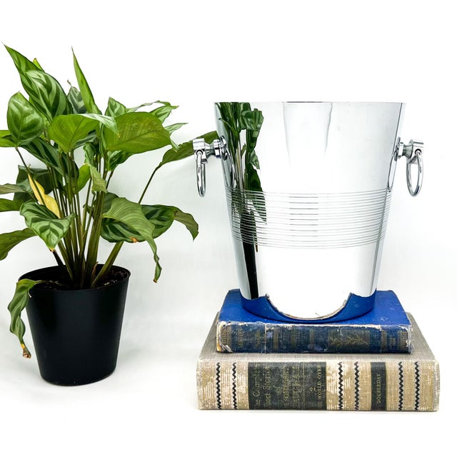 Sleek and quietly elegant French champagne bucket by André Leroy, featuring a clean tapered form accented with subtle...