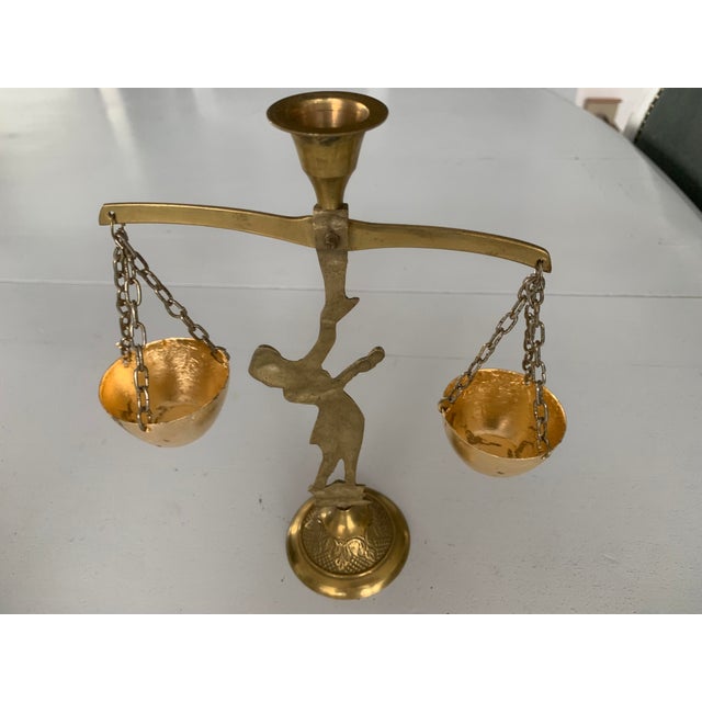 Brass figurine of a woman with scales - decorative candlestick" The figure holding the scales has a typical dress and...