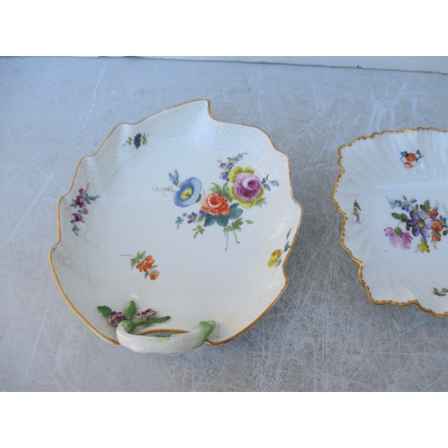 Mid-20th-century German dishes in Meissen style. One scalloped-rim dish from Western Germany by Nyphenberg, and the other...