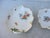 Mid-20th-century German dishes in Meissen style. One scalloped-rim dish from Western Germany by Nyphenberg, and the other...