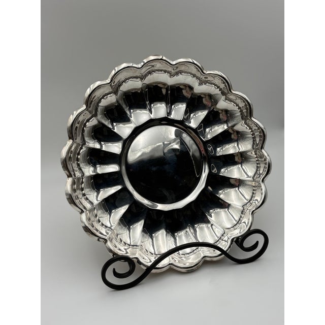 Round silverplate serving bowl by Reed & Barton in the Holiday pattern, model 109. Fluted sides rise to a scalloped rim...