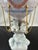 Lladro's "Through The Clouds" 6522 is a glossy figurine issued in 1998 and retired in 2002. It was sculpted by Francisco...