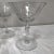 1940’s stemmed wine glasses from an unknown maker. The lightly undulating glass is cut in a stemmed floral and berry...