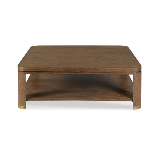 A square top is elevated on squared corner posts that are joined by a low shelf. Materials: Hardwood solids, Walnut veneer