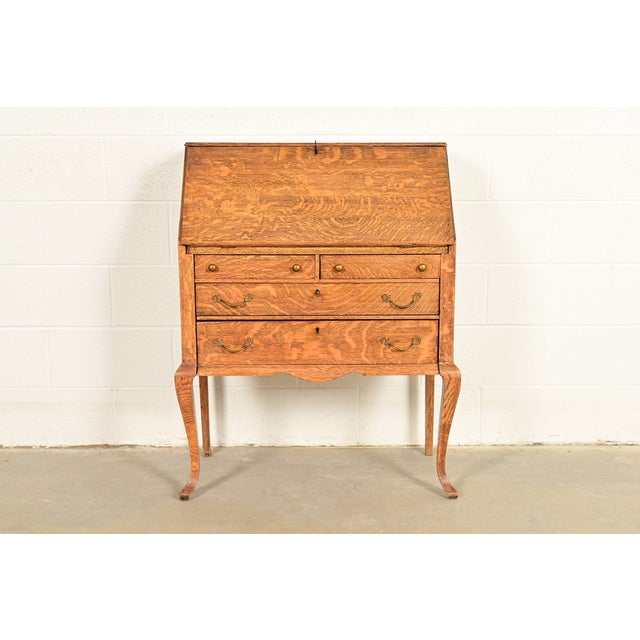 A gorgeous antique Victorian or Queen Anne slant front secretary desk or writing desk In the manner Berkey & Gay USA,...