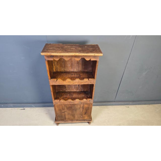 Primitive yet very sturdy bookshelf/cabinet made in the 1800s in France. The robust look is great as a contrasting piece...