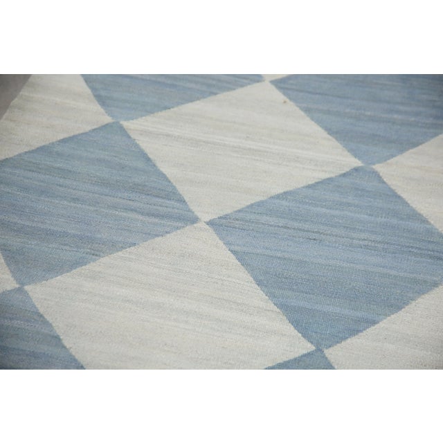 This exquisite Turkish flatweave kilim rug is a stunning masterpiece of traditional craftsmanship. Each rug is...