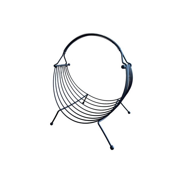 we have for your consideration a very beautiful 1950s atomic magazine rack.magazine rack consists of a atomic design that...