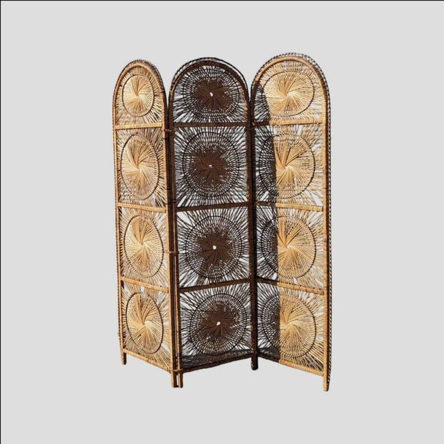 Bring timeless design into your home with this Mid-Century rattan room divider featuring a striking starburst pattern....