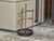 An English Late Victorian era brass umbrella stand from circa 1900 with pinecone motifs and iron base. Embrace the...