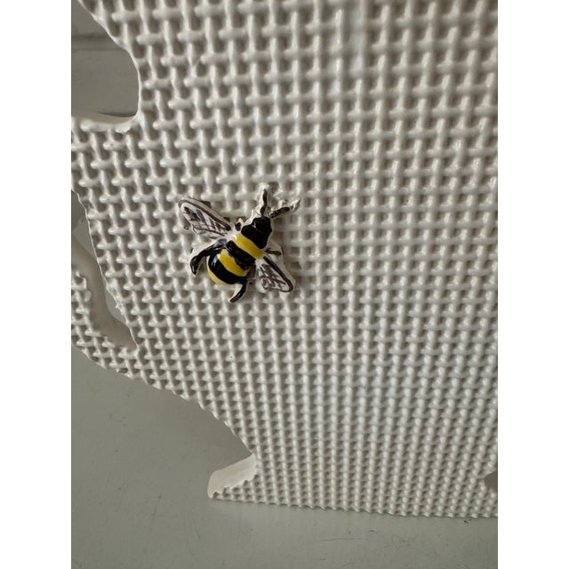 Darling textured silhouette vase that resembles a bee on a screen door . Hidden vase pocket for flowers, or use styled in...