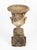 This impressive Neo-Classical style garden urn features a classic campana-form design with high-relief mythological...