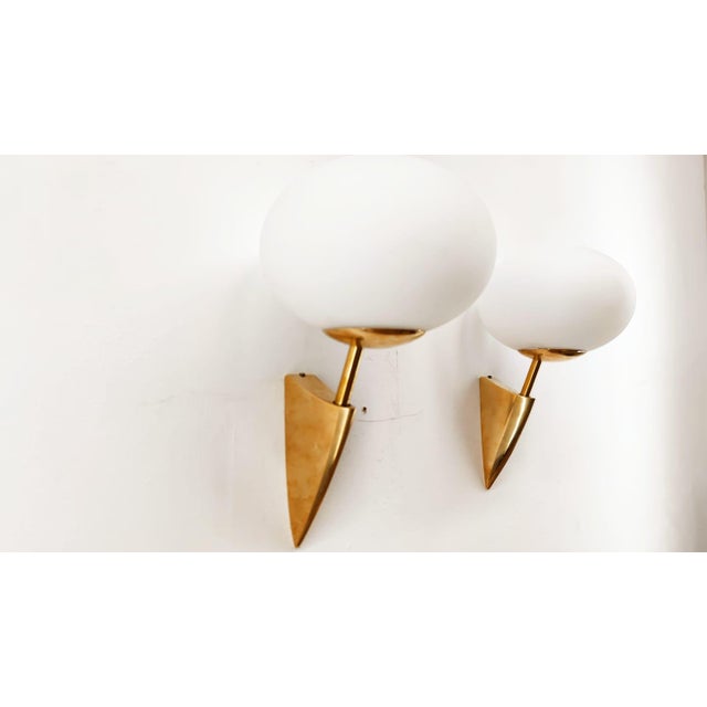 Brass Wall Light with Oval Glass Details, in Very Good conditions. Designed 1970 to 1979 Up to 250V (Europe/UK...