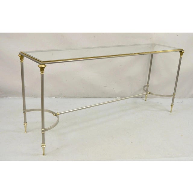 Vintage Neoclassical Maison Jansen Style Steel & Brass Console Sofa Table. Item features inset glass top, steel and brass...