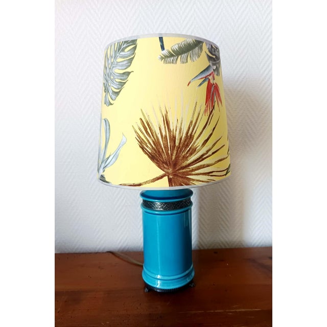 Ceramic lamp with a custom-made lampshade. Lamp base in turquoise blue ceramic, metal frame with claw feet. Custom-made...